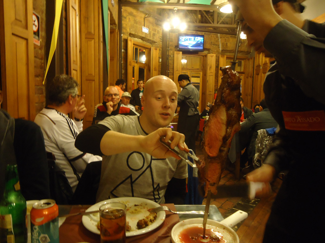 Action shot eating Churrasco meat.